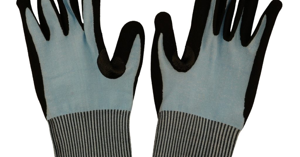 Gray cut-resistant safety gloves with black nitrile coating on fingers and palms, featuring ribbed cuffs with yellow trim.