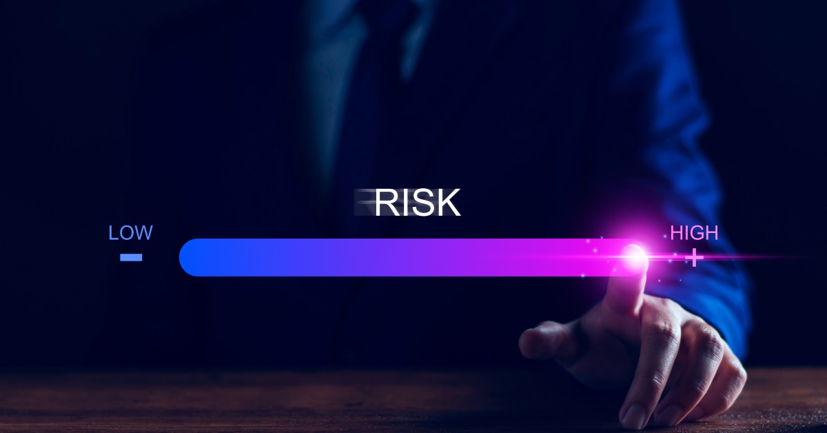 A hand adjusts a digital risk level slider from low to high, illustrating a business security assessment and threat evaluation.