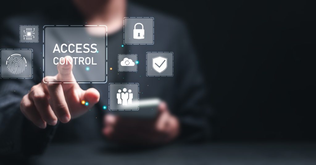 A person taps a virtual access control screen surrounded by glowing security icons on a dark background.