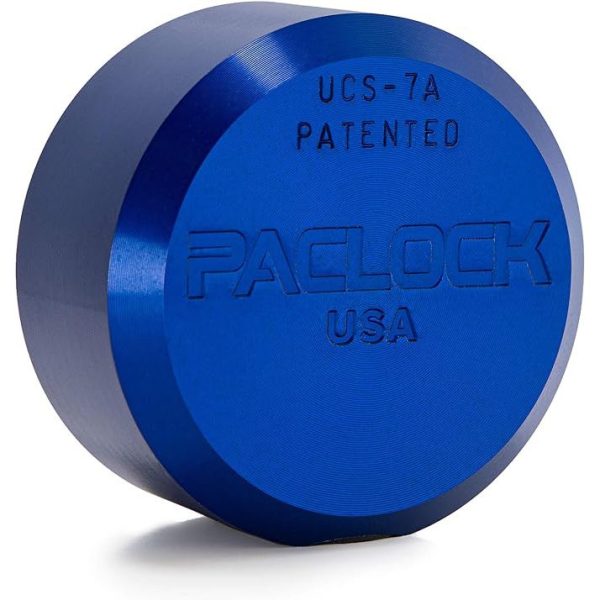 A large, blue, hockey puck style locking mechanism that has the brand name "Paclock USA" embossed on it.